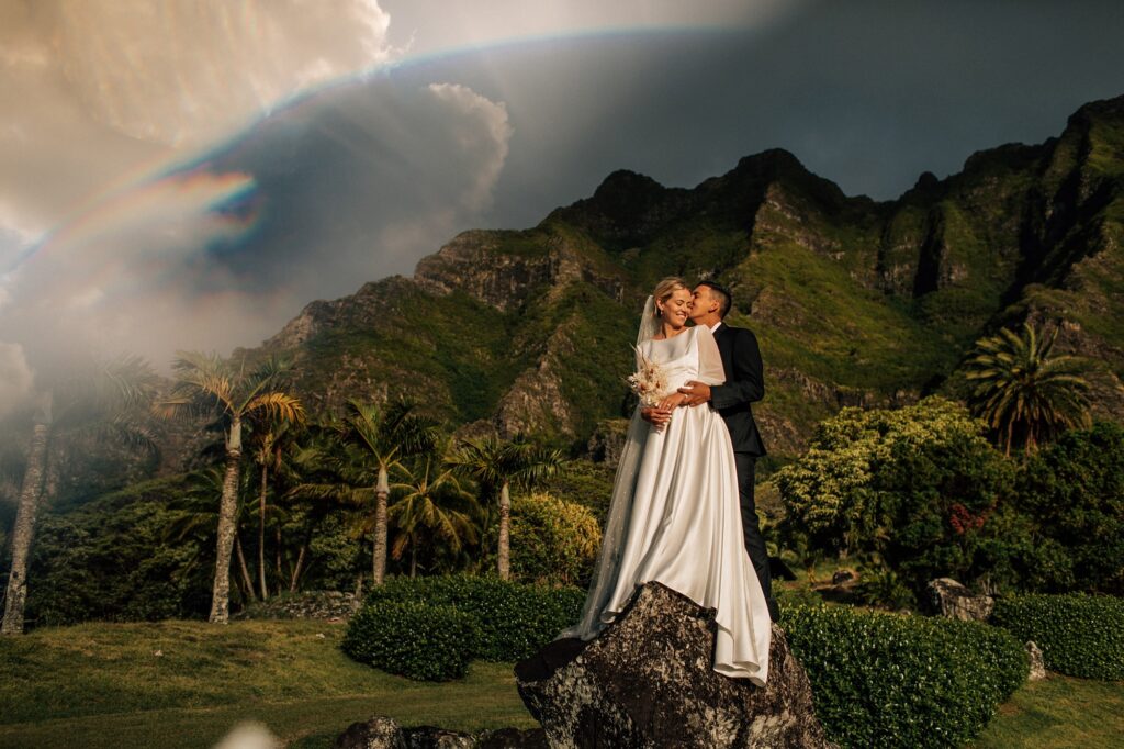 couple embracing at a kualoa ranch wedding