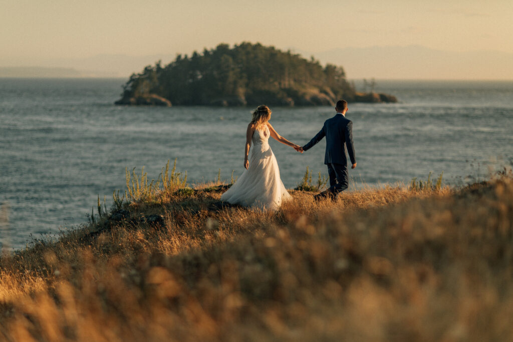wedding portrait of couple walking at deception pass