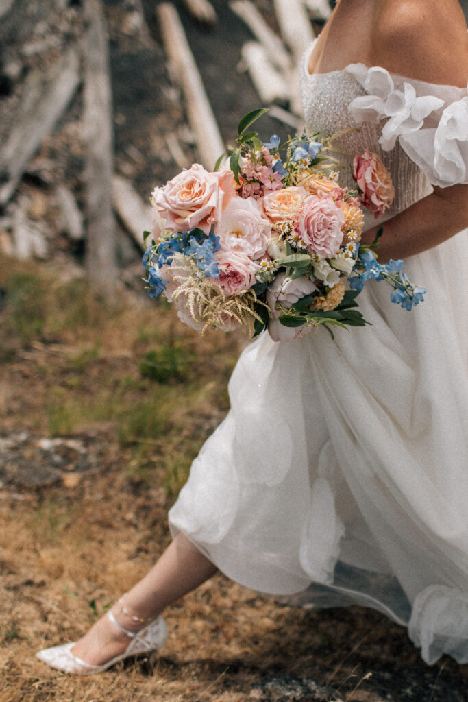 san juan island bride walking with her bouquet