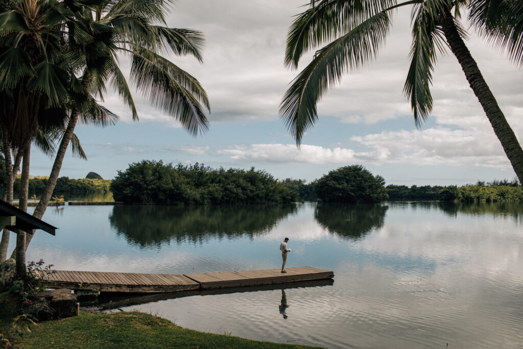 kualoa ranch wedding groom on dock