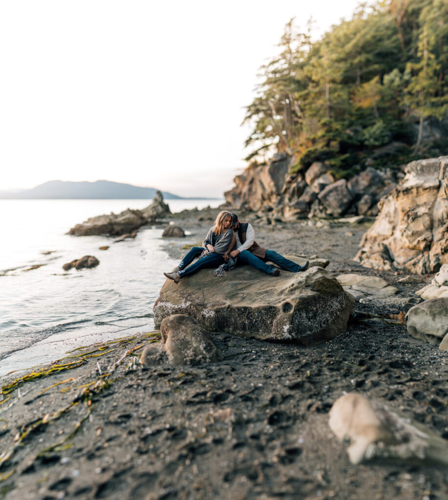 couple on a rock at larrabee state park Bellingham Wedding Photographer